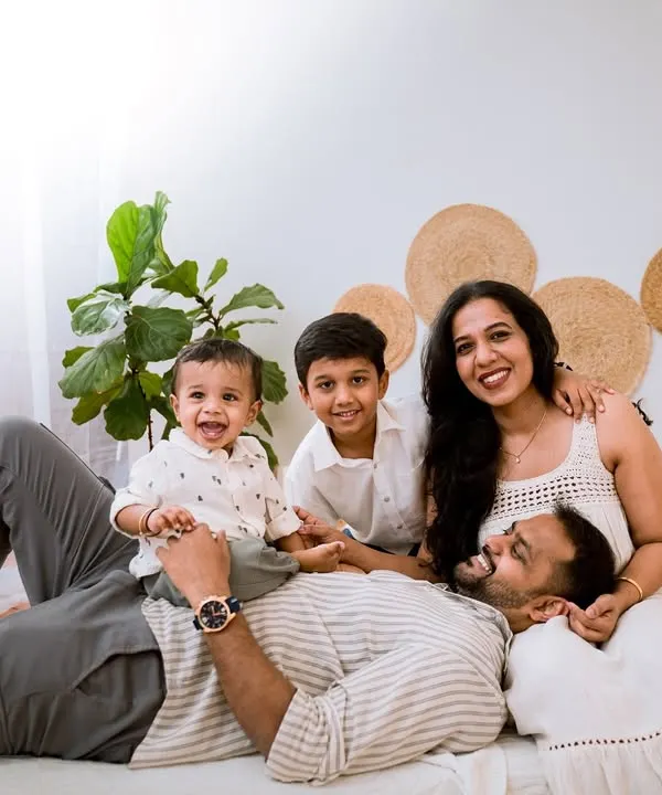 A timeless family portrait is something you will treasure forever. We set up this clean, minimalist scene in our studio to ensure the focus remained entirely on this family's beautiful connection and happy smiles.