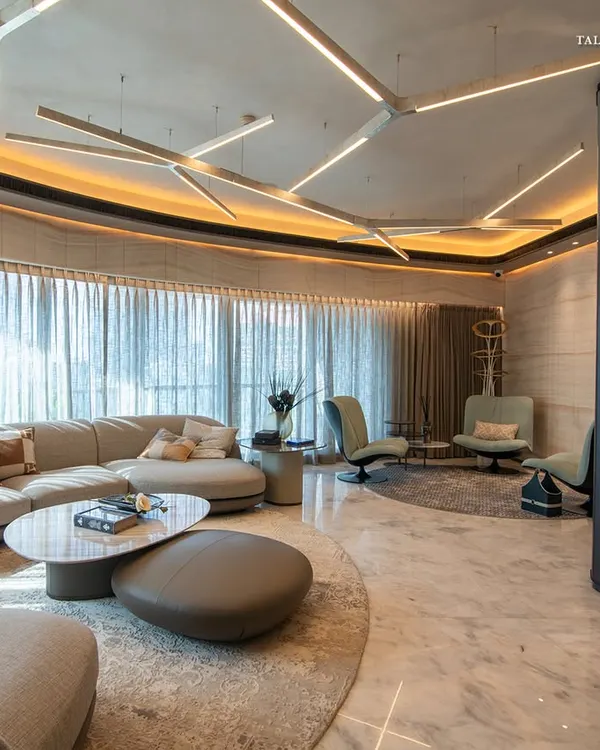 At a luxe residence in Lodha World View, the apartment's inherent curves create a seamless flow between spaces. The spacious 3,800 sq. ft. living area reflects a perfect balance of opulence and elegance, with expansive windows framing breathtaking views of Mumbai.
