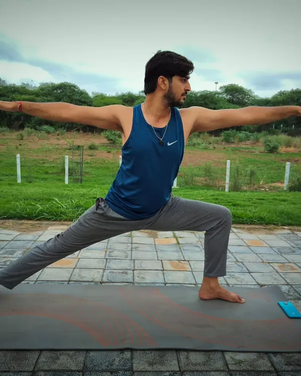 The Virabhadrasana 2, or Warrior Pose, is a fundamental asana for building strength and stability. I teach this to help you strengthen your leg muscles, improve focus, and challenge your body's balance.