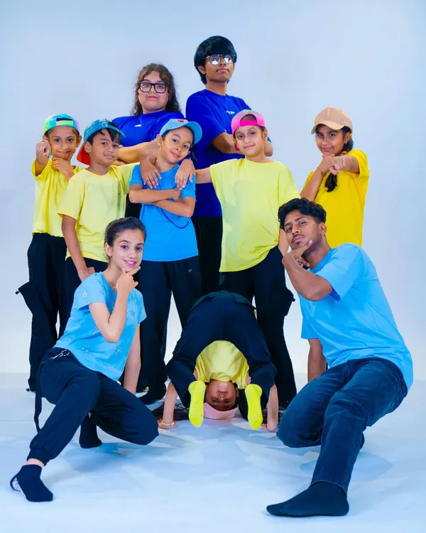 Our young b-boys and b-girls showing off their attitude and style during a studio photoshoot. We encourage self-expression and confidence in all our students.