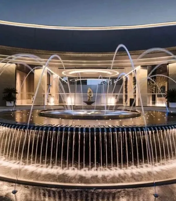 This grand, circular fountain at a commercial property in Chandigarh is a work of art. The combination of cascading water and arcing jets, all illuminated from below, creates a spectacular and dynamic centerpiece.