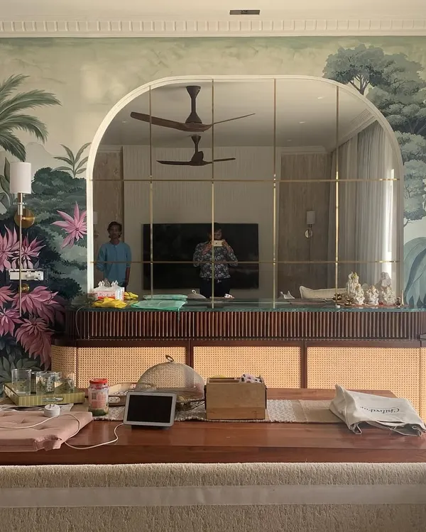 This wide view shows how a nature-themed mural can envelop an entire wall, creating an immersive and calming environment in a dining area. The artwork is composed to work with the room's architecture.