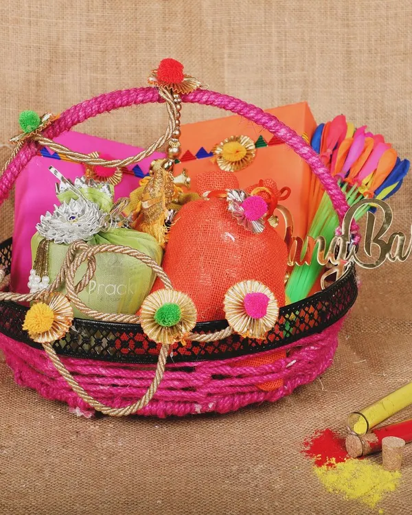 A vibrant Holi festival gift basket, styled with colors and festive elements to create an attractive image for seasonal marketing.