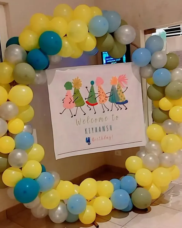 A simple and sweet circular balloon frame with a custom "Welcome to Birthday" banner inside.