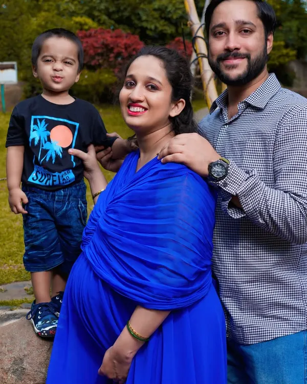 A heartwarming family portrait with their first child. I focus on capturing the natural interactions and joy as your family prepares to welcome a new member.