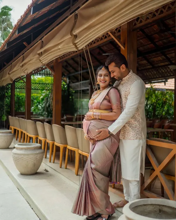 A beautiful portrait of an expecting couple, framed by the warm, natural architecture. This maternity session was all about capturing their shared excitement and love.