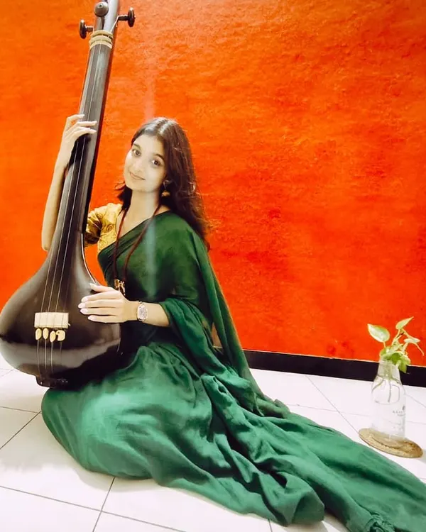 Another moment with my tanpura, finding my center before a practice session. The drone of the tanpura helps me tune my voice and my soul.