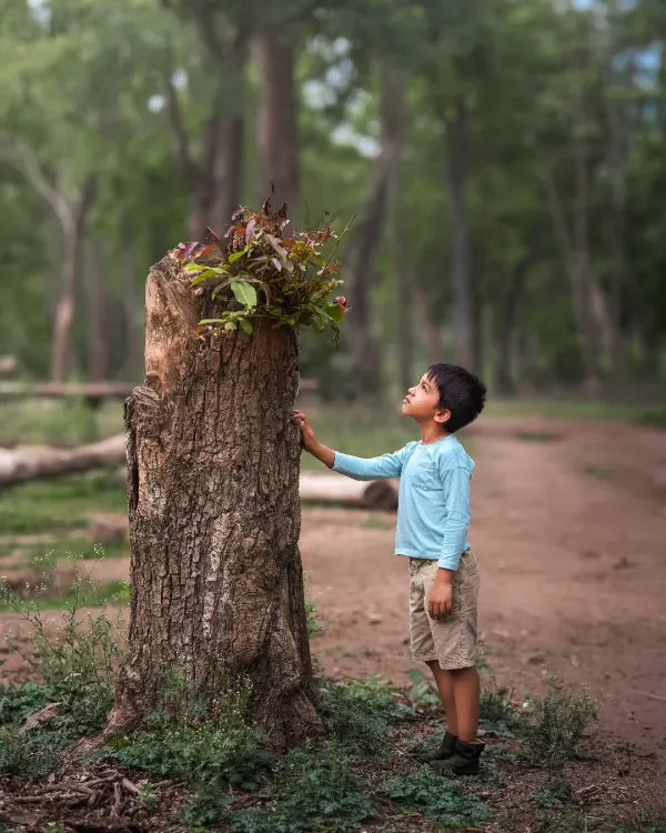 A single child, lost in thought, interacting with nature. This is the core of my work: finding the quiet, poetic moments that reveal a child's inner world.
