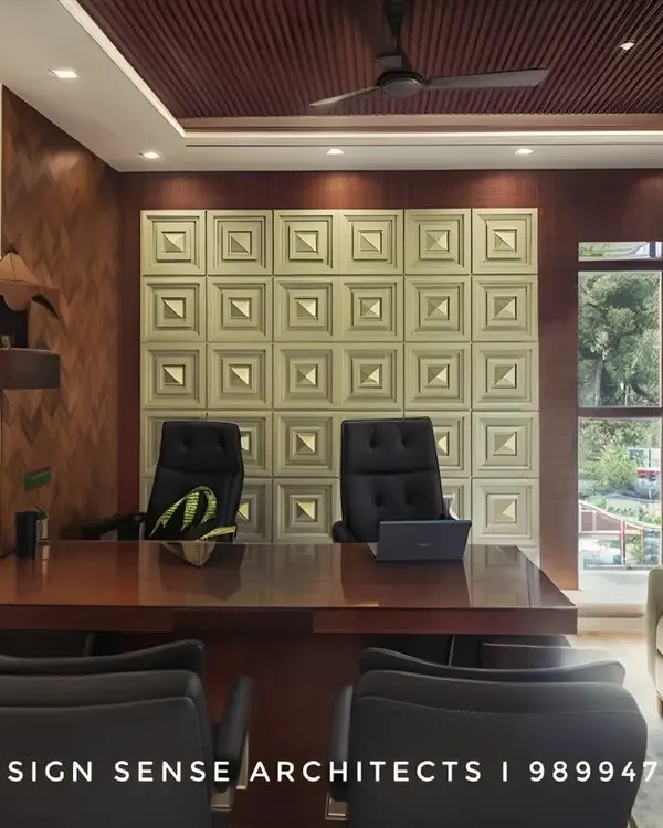 This is a completed factory office we designed in New Delhi. The goal was to create a professional and comfortable environment with rich wood tones, a textured feature wall, and elegant furniture that feels both commanding and welcoming.