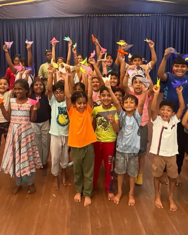 The pure joy of a completed project is captured in this photo of our students holding up their origami creations. Our group craft sessions are filled with energy, collaboration, and lots of happy faces.