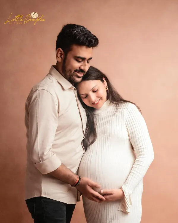 Creating elegance from simplicity. This sweet and simple couple's portrait in my studio beautifully captures the tenderness and anticipation of waiting for their little one.