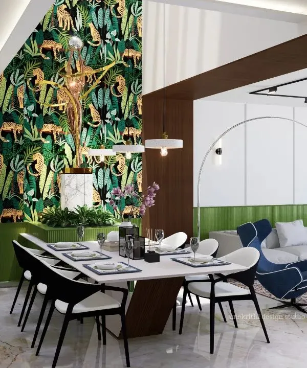 This open-plan living and dining area is designed to be the emotional core of the house. The layout fosters togetherness, allowing for easy interaction between the kitchen, dining table, and lounge area. The feature wallpaper adds a dramatic yet tasteful touch of nature.