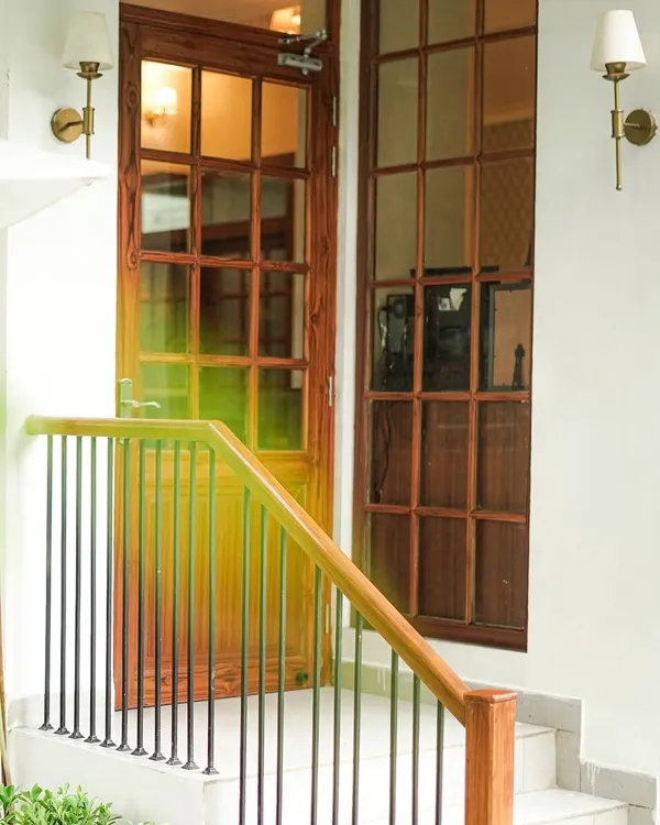 The entrance to our revamped cafe at Sangeet Shyamala in Vasant Vihar. The classic wooden doors and warm lighting welcome you into our cozy space.