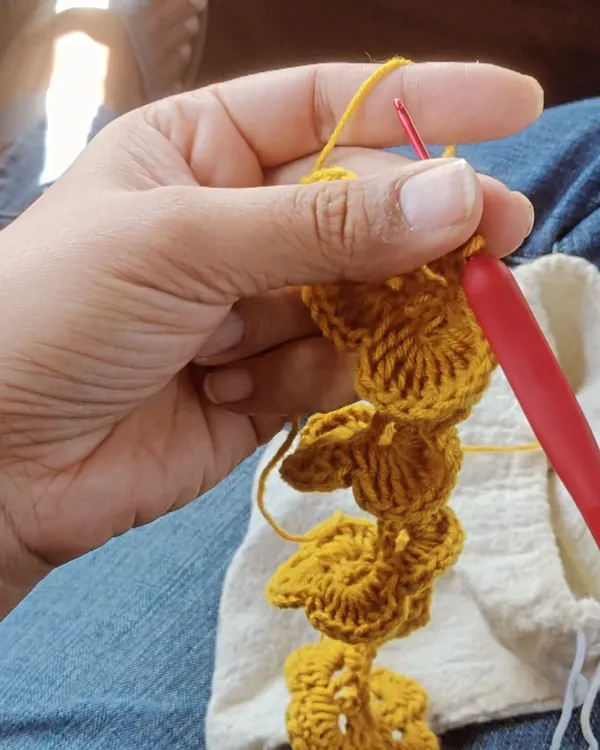 I always carry my crochet kit when I travel. I made this little yellow flower during a cab ride. My little bag of yarn turns any moment into a creative one.