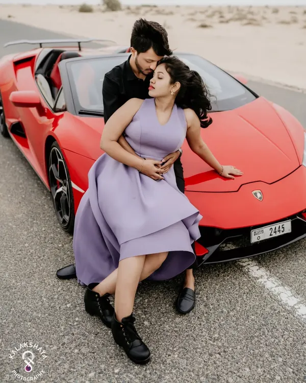 A high-fashion moment in the Dubai desert. This pre-wedding shoot combines the thrill of a luxury sports car with the romance of the open road.
