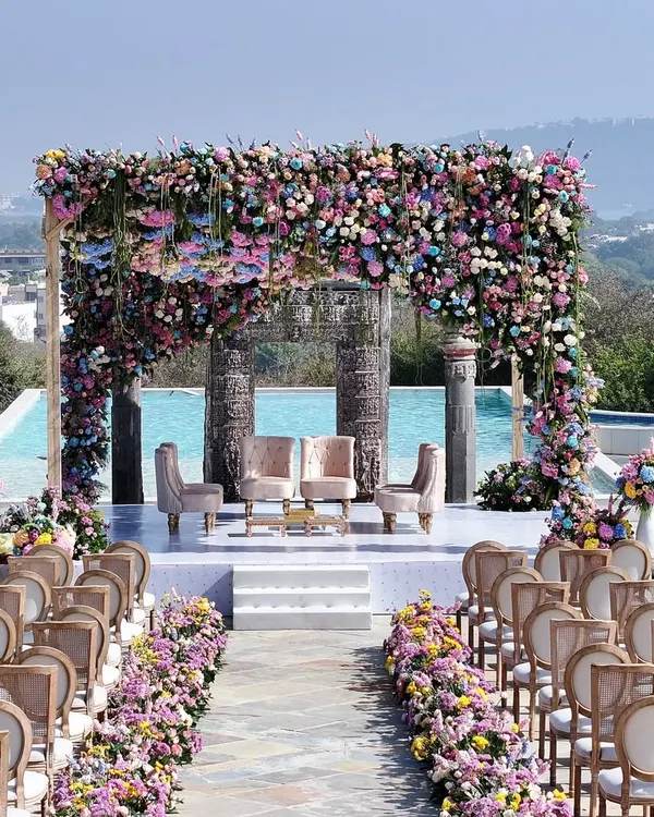 A breathtaking mandap overlooking the hills of Udaipur. I designed this pastel floral paradise by the poolside to feel both grand and intimate, creating a serene and royal setting for the wedding vows.