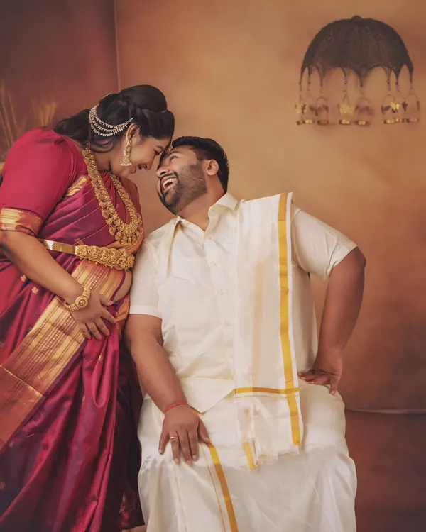 The laughter and love between this couple is just everything. Dressed in traditional South Indian attire, this moment captures the pure happiness of their journey together.