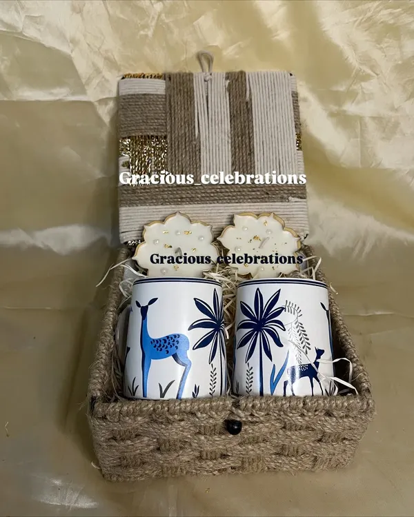 A beautiful Diwali hamper to share the joy of the festival. This jute box contains two elegant deer-printed mugs and matching coasters, perfect for gifting with love.
