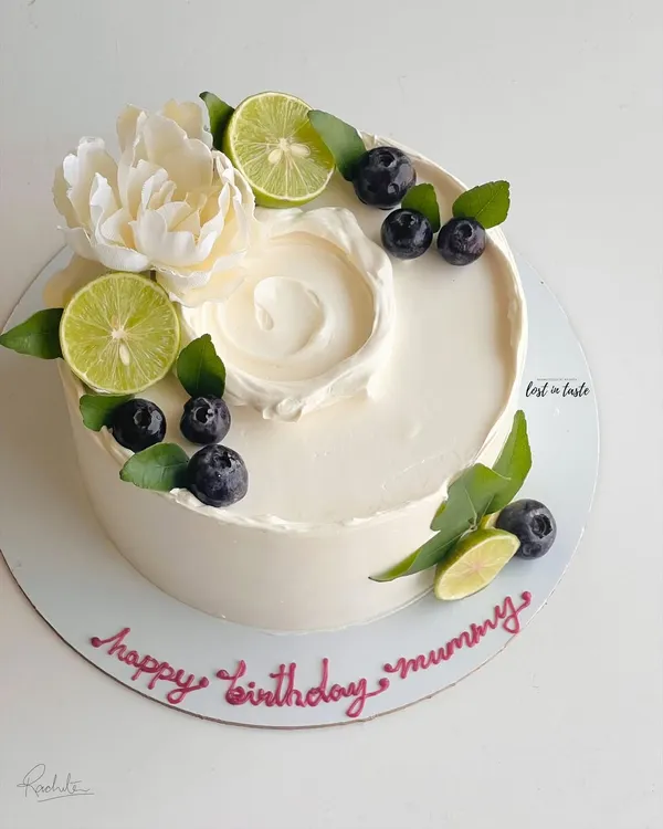 My most popular creation, the signature Italian Lemon & Blueberry cake. I offer many design variations, all featuring fresh blueberries, zesty lime, and smooth buttercream.