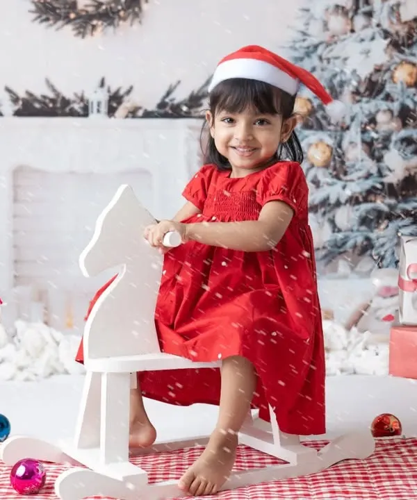 A little one's first Christmas. My festive mini sessions include adorable Santa outfits and a winter wonderland setup to capture this special milestone.