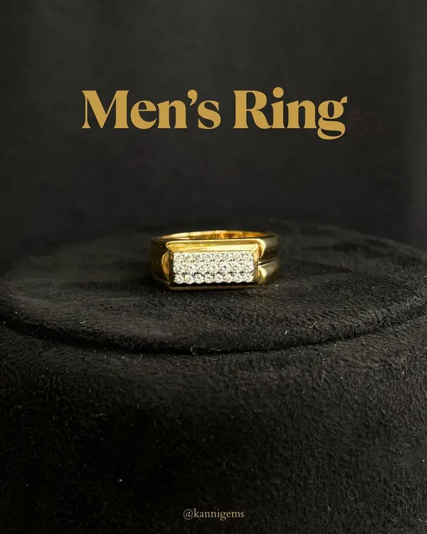 A classic men's ring design featuring two clean rows of pavé-set diamonds on a rectangular gold face. The polished band and sharp lines make it a powerful yet refined statement piece, seen here on a display stand.