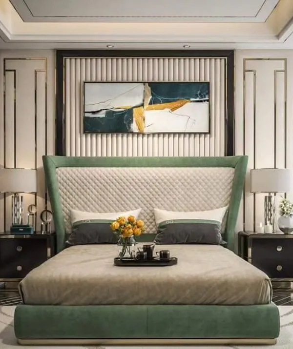 This luxurious master bedroom concept features a green upholstered bed with a quilted, wingback headboard and integrated wall paneling. We can create this entire look, including the matching bedside tables, for a cohesive and high-end design.