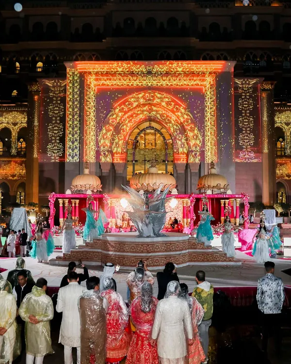 A sangeet night where the entire facade of a palace became the stage. I used projection mapping to create a dynamic, colorful backdrop for the performances, turning the architecture into a living part of the celebration.