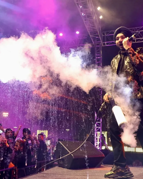We bring star power and excitement to your event. Here, singer Gurdeep Mehndi electrifies the crowd with a CO2 cannon during a New Year's Eve concert, a moment of pure energy that we planned and executed.