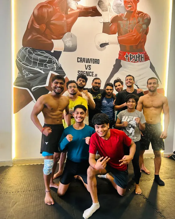 The octagon is our canvas, and we are the artists. A group photo of our team after a hard training session, showing the camaraderie and results of consistent hard work.