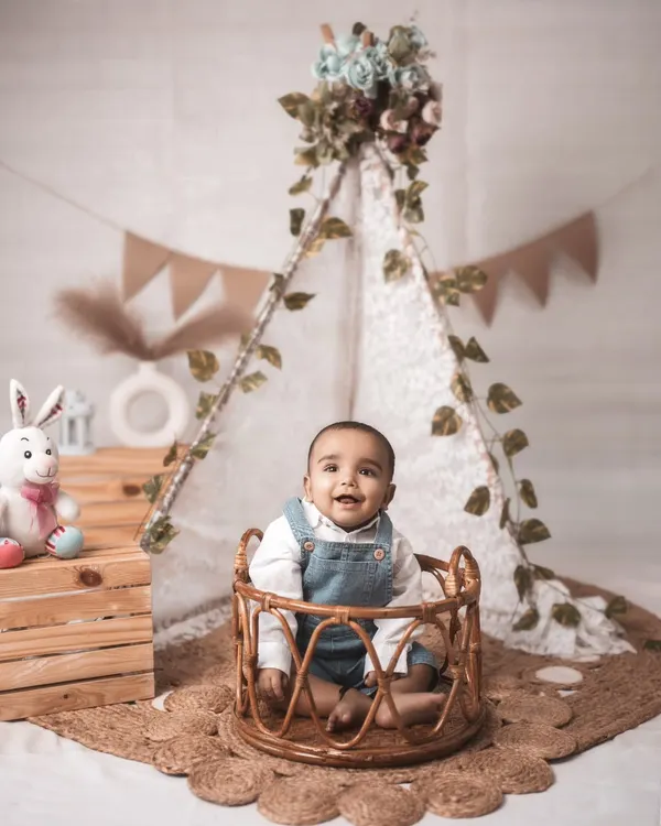 The cutest little explorer in his own boho-themed world. That infectious smile and the dreamy, rustic setup come together to create a magical portrait of babyhood innocence.