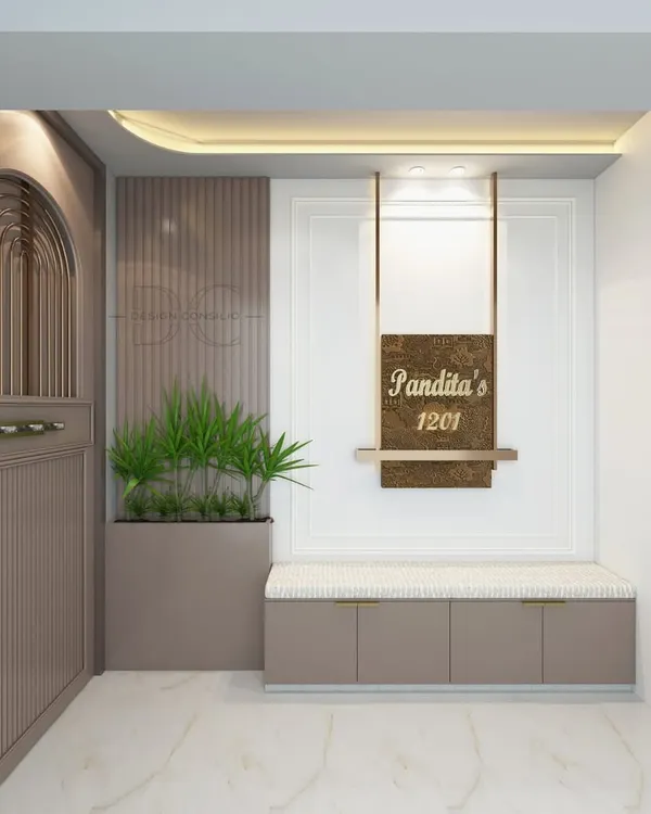 An elegant first impression starts at the doorstep. We designed this entrance with a custom safety door, a personalized nameplate, and a comfortable seating bench with built-in shoe storage.