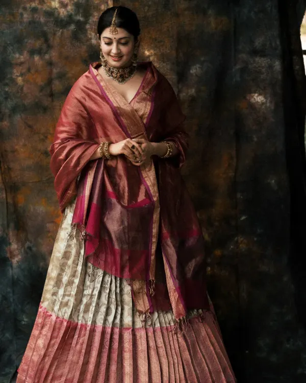 This portrait captures a sense of timeless royalty. I used a textured backdrop and specific lighting to sculpt the subject, highlighting the rich fabric of the lehenga and the intricate details of the heritage jewelry, creating a powerful and elegant final image.