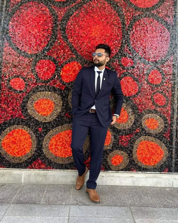 A sharp, classic two-piece suit in navy blue. This is a versatile bespoke piece, tailored for a clean fit that works for business meetings or formal events.
