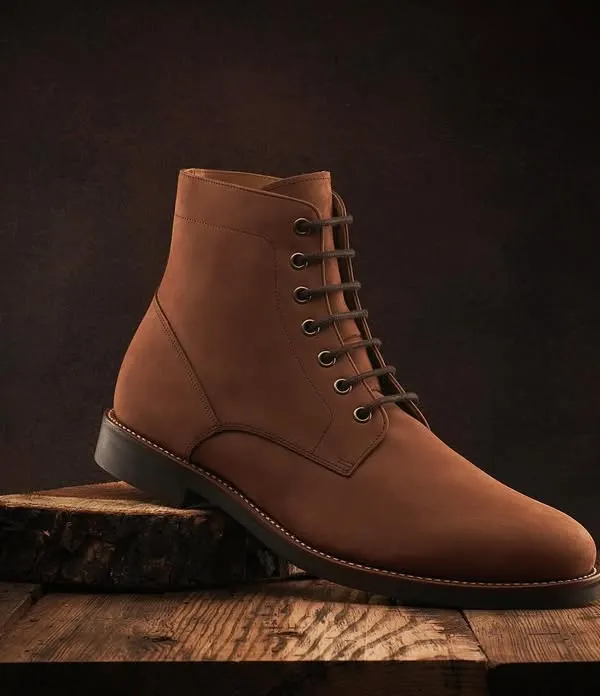 I love the woody, warm tones in this shot for Hanker Boots. We created a rustic, masculine setting with a tree stump and wooden planks to complement the brown suede boots. The lighting is soft and directional, highlighting the texture of the suede.
