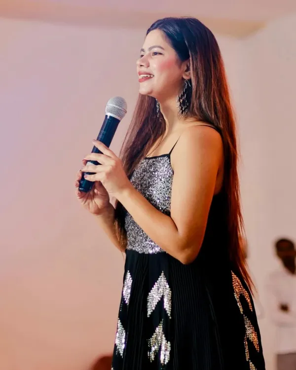 A candid shot on stage, sharing a smile. I'm always in my happy place when I have a mic in my hand.