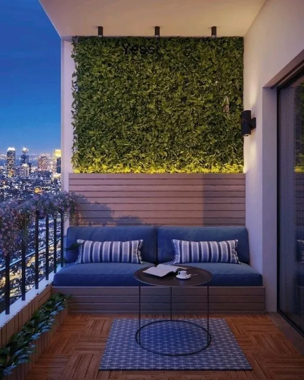 We create serene, beautiful balcony escapes right in the heart of the city. This setup features a custom-built seating area complemented by a lush, illuminated green wall, turning a simple space into a private oasis.