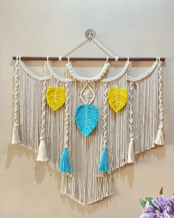 This large, vibrant wall hanging is a perfect example of a statement piece that can transform a room. I loved blending the bright yellow and cool blue tones with intricate knotting to create something truly special.