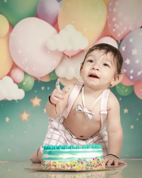His first birthday cake! That little bit of frosting on his finger is the cutest. These moments are so fun and messy.