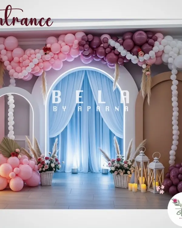 This grand entrance uses a multi-layered arch design with extensive balloon work in shades of pink and burgundy. The neon-lit central arch and draped fabric create a dramatic and welcoming entryway for an elegant celebration.