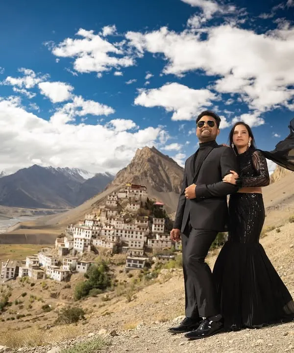 Standing together against the stunning panorama of Key Monastery in Spiti. The flowing black gown adds a touch of drama to the rugged, high-altitude desert landscape.