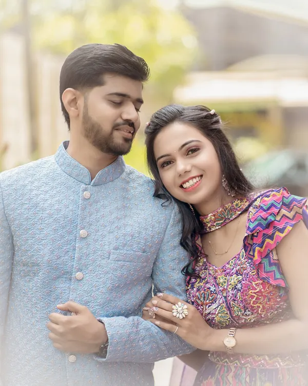 A gentle moment of comfort and affection. This classic pre-wedding portrait captures the quiet trust and love between a couple.