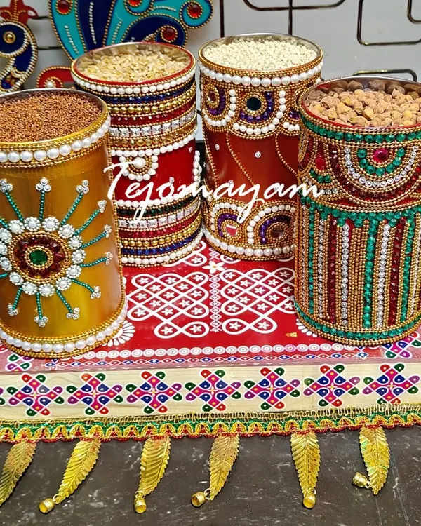Every corner begins with a blessing. This is a traditional offering set for a housewarming ceremony, with decorated containers of grains on a hand-painted tray.