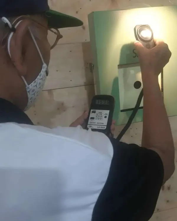 I believe in precision from start to finish. Here, I am using a lux meter to ensure the target illumination meets the strict standards set by the International Shooting Sport Federation (ISSF), guaranteeing a fair competition for every shooter.