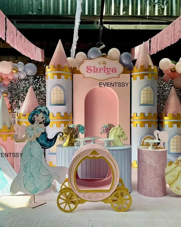 A complete Disney Princess castle stage, featuring life-sized cutouts of Cinderella, Jasmine, Snow White, and Elsa, ready for a royal celebration.