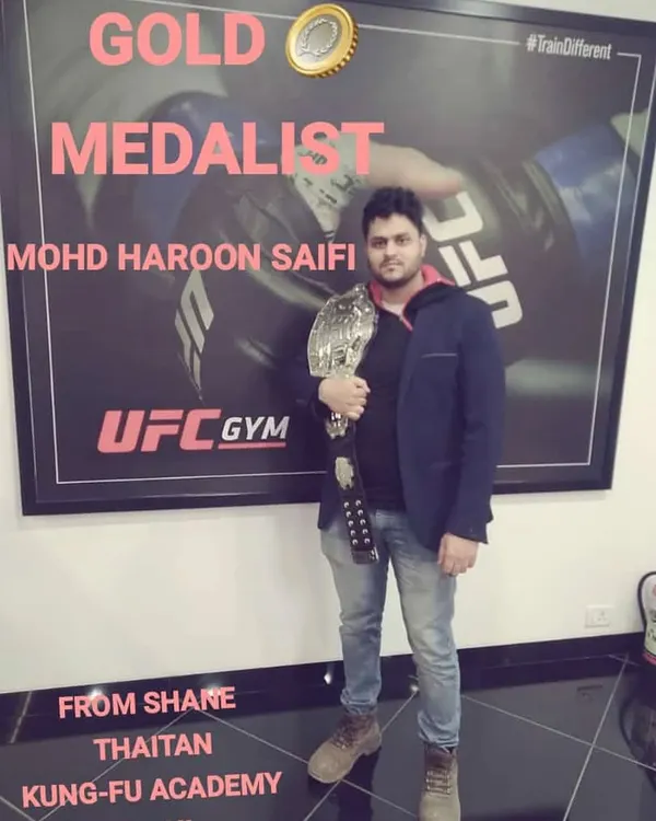 Gold medalist Mohd Haroon Saifi. This is what winning looks like. He holds the championship belt, proof of his skill and the effectiveness of our freestyle MMA training.