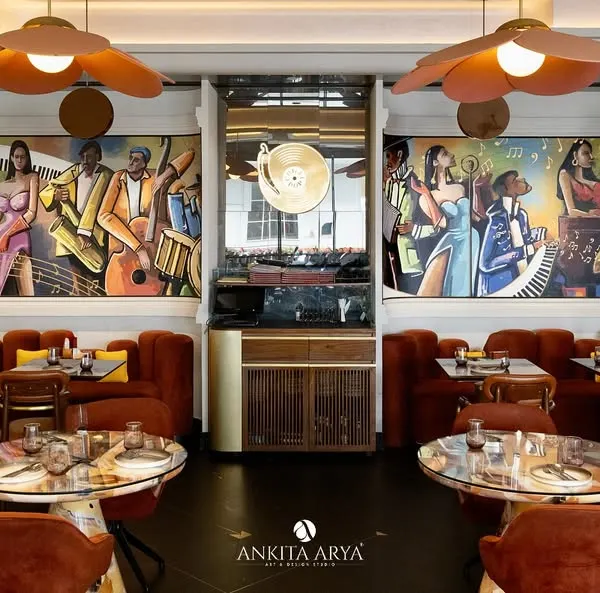 A wide view of the hand-painted jazz murals I created for Chilli Pop restaurant in Delhi. The vibrant, energetic artwork spans multiple walls, setting a lively, musical tone for the entire space.