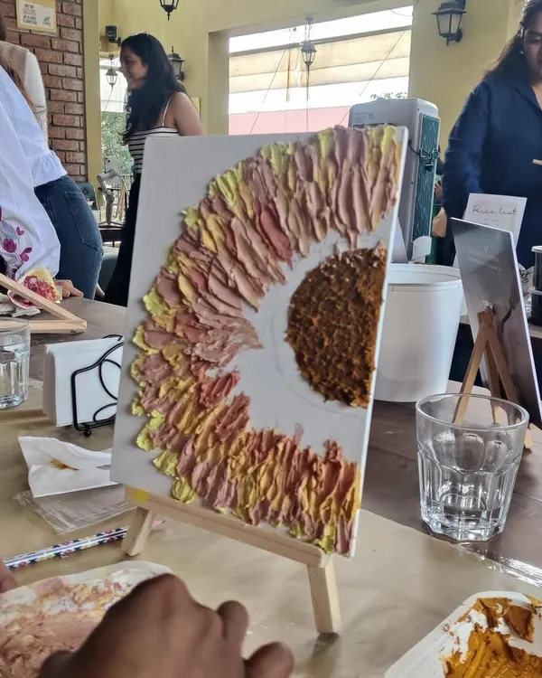 A sunflower coming to life with thick, satisfying strokes of texture paste. The beauty is in the imperfections and the bold textures.