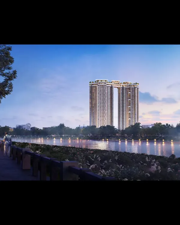 An evening view of our twin towers in Koregaon Park, Pune, overlooking the river. The design features a connecting sky bridge, creating a harmonious and iconic addition to the urban skyline.