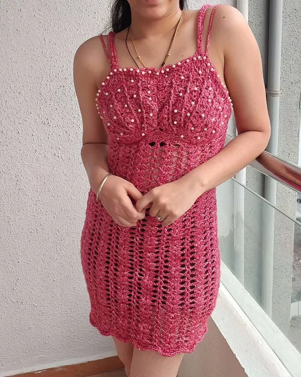 This stunning, made-to-measure Sirena dress features delicate pearl beading on the bust and a beautiful, body-hugging silhouette. I can customize the fit, color, and details like the back lacing to create your perfect statement piece.