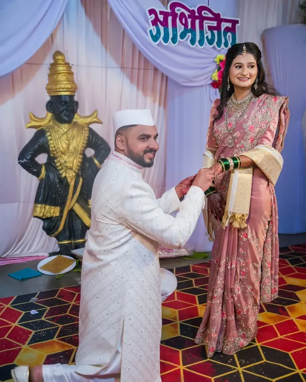 A beautiful moment from a ring ceremony, with the groom-to-be kneeling to present the ring. We capture these traditional and heartfelt gestures with reverence and care.